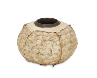 164
An Allen Moe Hide-Covered Pottery Bowl
(b. 1948, American)
The black ceramic bowl with stretched sheepskin and deerskin over crab skeletons
3.75" H x 5.75" Dia.
Estimate: $300 - $500