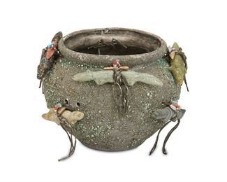 165
An Edna Leki Zuni Fetish Pottery Bowl
(1924-2003, Zuni)
The pottery bowl covered in turquoise and azurite chips and adorned with hand-carved stone fetishes tied with sinew
4.5" H x 7.25" Dia.
Estimate: $300 - $500