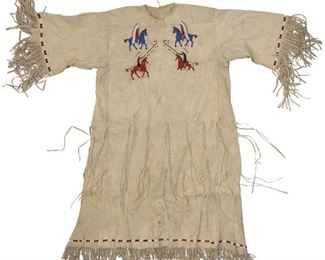171
A Plains Pictorial Beaded Hide Dress
First-half 20th Century
The front depicting four figures on horseback, the back with six figures on horseback most wearing full feathered headdresses
49" L; Waist: 26"; Cuff to cuff: 48"
Estimate: $800 - $1,200