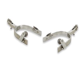 182
A Pair Of Garcia Sterling Silver Overlay Spurs
Second-half 20th Century
Signed: Garcia / Elko, Nev. / 3
Each sterling silver overlay with gold-toned accents decorated with chased designs, 2 pieces
Each: 1.75" H x 3.5" W x 5.5" D
13.705 gross oz. troy approximately
Estimate: $300 - $400