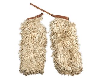 181
A Pair Of White Wooly Chaps
20th Century
The long hair-on-hide chaps with tooled leather weave motif belt and pockets
37.5" L x 43.5" W approximately
Estimate: $500 - $700