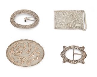 184
A Group Of Silver Belt Buckles
An oval 10K yellow gold and sterling buckle stamped VOGT / Sterling / 10k; a rectangular buckle, an open oval buckle, an open cartouche shaped buckle
Largest oval buckle: 4.50" L x 3.25" W
281 grams
Estimate: $500 - $700