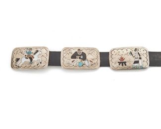 192
A Navajo Benjamin Becenti Concho Belt
Fourth-quarter 20th Century; Stamped: BB
Designed with eight rectangular conchos and a buckle depicting scenes of everyday life inlaid with mother-of-pearl, coral, onyx, and turquoise
42.25" L x 1.825" H; Buckle: 1.825" H x 3" W
421 grams
Estimate: $600 - $900