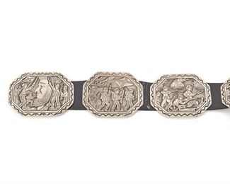 190
A Navajo Floyd Becenti "Civil War" Concho Belt
1996 <br /> Stamped: Civil / F/ Becenti / BCT / Sterling / North/South / (c) / 11/96
Designed with eight octagonal conchos and a buckle with scenes of Civil War conflicts
44" L x 3.125" H; Buckle: 3.125" H x 4.125" W; Leather length: 41" L
982 grams
Estimate: $800 - $1,200