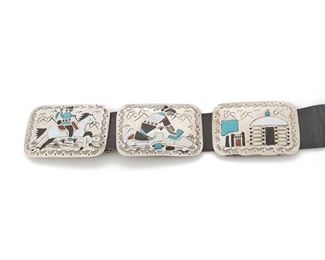 193
A Navajo Benjamin Becenti Concho Belt
Fourth-quarter 20th Century; Stamped: BB Sterling
Nine conchos and the buckle designed with unique scenes from daily life inlaid with coral, mother-of-pearl, onyx and turquoise
46.25" L x 2.25" H; Buckle: 2.25" H x 3" W; Leather length: 43" L
488 grams
Estimate: $600 - $900