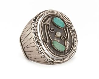 212
A Southwest-Style Swivel Cuff Bracelet
Designed as a cuff centering a plaque set with turquoise that swivels to reveal and different plaque
6" L x 2.5" H x 1.6" W
82.6 grams
Estimate: $300 - $500