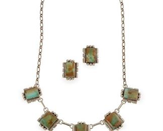 217
A Set Of Sam Piaso Silver And Turquoise Jewelry
Necklace stamped: Sam Piaso / Sterling
Comprising a fringe necklace set with Royston turquoise together with a pair of matching earrings
Necklace: 18" L; Each earring: .875" H
48 grams
3 pieces
Estimate: $300 - $500