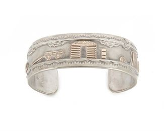 216
A Roland Hogan Begay Storyteller Cuff Bracelet
Sterling silver and 12K gold stamped: R. H. Begay <br />
Topped with a gold life style scene
6.25" L x 0.75" H
39 grams
Estimate: $200 - $400