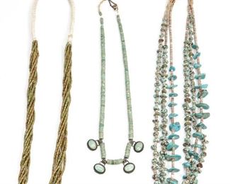 218
A Group Of Pueblo-Style Multi-Strand Turquoise Necklaces
Mid-20th Century or earlier
Comprising an eight-strand cylindrical turquoise beaded necklace, a double-strand turquoise nugget and heishi necklace, a single-stand turquoise tab and heishi necklace, a graduated turquoise necklace with four silver and turquoise tabs, 4 pieces
Longest necklace: 32"
Estimate: $600 - $900