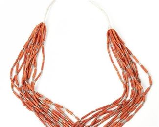 221
A Pueblo-Style Multistrand Coral Necklace
Third-quarter 20th Century
An eleven-strand beaded necklace of cylindrical coral and accented with similar silver beads
32" L
Estimate: $300 - $500
