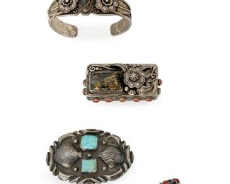 227
Four Southwest Gold Quartz And Coral Jewelry Items
Mid-20th Century; Bracelet stamped: diamond plaque with pictorial mark of mountain in circle [maker unidentified]
Comprising a ring (size: 8.5"), a cuff bracelet set with coral and gold quartz (6.625" C), and a hinged pillbox (1.125" H x 2.25" W); together with an oval belt buckle with two square cut turquoise stones, silver dots and leaf applique
3 pieces
Estimate: $500 - $700