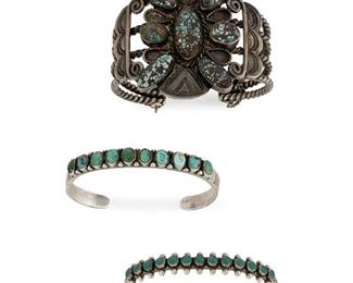 228
Three Silver And Turquoise Cuff Bracelets
Mid-20th Century
Comprising a thin row bracelet set with ten stones, a curio-row bracelet with turquoise stones and applied rain drops to edges, and a bracelet with four twisted wires supporting a central turquoise-inlaid plaque
Largest: 6.5" C x 2.25" H, wrist opening: .875"
107.95 grams
3 pieces
Estimate: $500 - $700