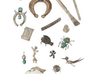 236
A Group Of Southwest Silver Jewelry Items
Comprising a thimble, a page marker, an early stone-set naja, a stamped naja, a shell and silver and white buffalo fish-motif bolo, a roadrunner pin, a child's bracelet, a small pillbox, a letter opener, a yei pin, and three bug pins
Largest: 5.325" L
220.5 grams
16 pieces
Estimate: $500 - $700