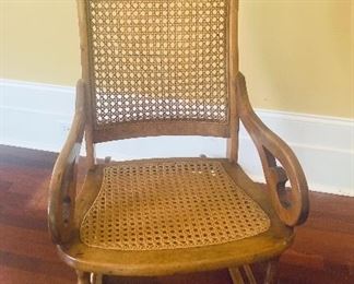 #1028D - Antique Lincoln  rocking chair with cane back and seat - $225