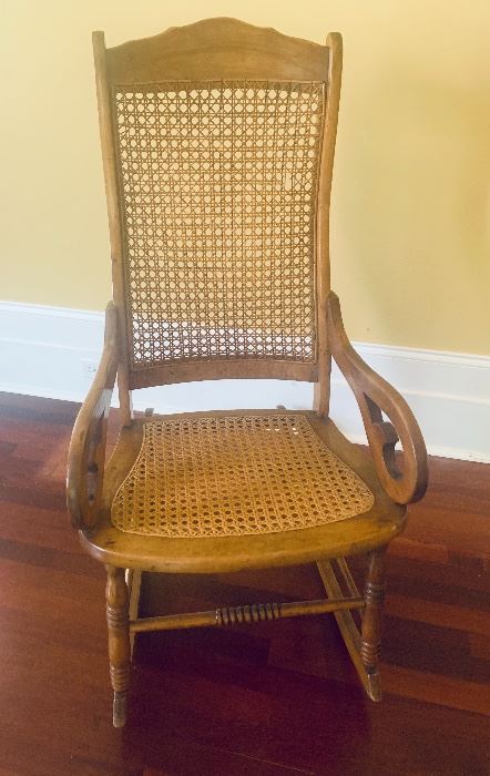 #1028D - Antique Lincoln  rocking chair with cane back and seat - $225