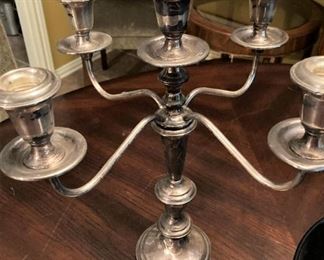 One of two silver candelabras
