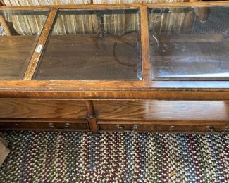 Glass top coffee table; 1 or 2 oval braided rugs