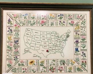 Hand-stitched map of the USA featuring state flowers