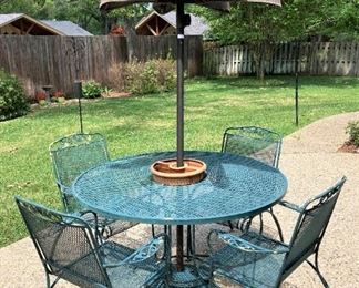 Table, 4 chairs, and umbrella