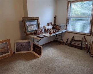 Same room, more art prints, and western items, and saws.