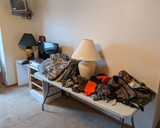 Men's shorts (42), and outdoor wear hats, gloves belts.  Also a couple TVs, wall shelves and RCA receiver.