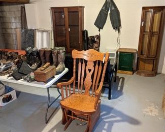 XL Solid wood glider rocker ASking $60, Futon, Curio $10, Gun Cabinet $50, deer blind, rod container, waders, boots and shoes. All in basement.