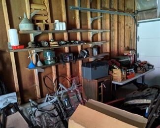 Garage - Some of the THIRTEEN tree stands, tools, feeder, funnels, cabinet, tool box, and more.