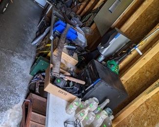 Old jars, car ramps, stereo, sharpener, bird house, and lots of tools. 