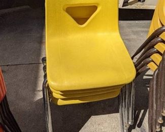 (4) Bright Yellow Stackable Chairs