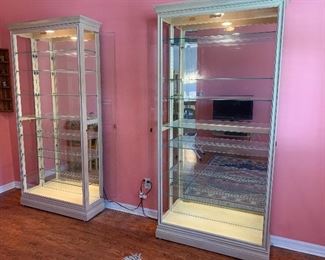 2 lighted shelving cabinets with slotted glass shelves for displaying plates, etc.