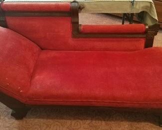 Red velour fainting couch.