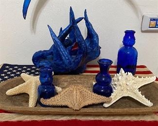 One eyed, essential large plaster octopus , baby face milk bottles , dough bowl , cotton flag