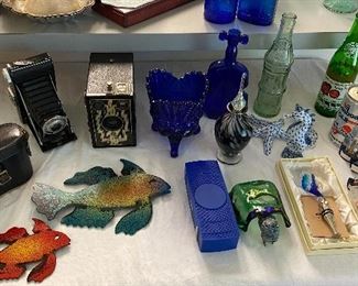 Artisanal metal fish, blue glass, Old cameras, old bottles, Sea themed treasure