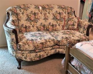 Antique settee in a floral upholstery