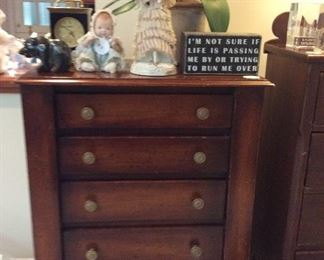 A diminutive chest of drawers   