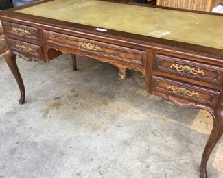 French Writing Desk with Carved Panelsbrass handware, leather top and pull out sides with leather top