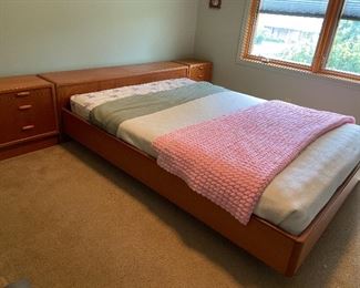 Scandinavian Mid Century Modern Style Teakwood Platform Bed, has storage that opens up to Headrests, & matching Nightstands