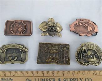 (4) Hawaii, (1) Washington, (1) Colorado Belt buckles