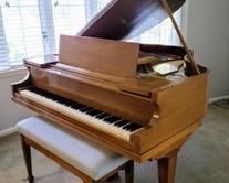 Amazing Foster and Co. Baby Grand Piano. Absolutely beautiful piano! There is a few small scratches, but in otherwise excellent condition and was recently professionally tuned and dusted. The piano measures 56” x 55” and 36” high