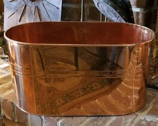 Copper oval container with handles.