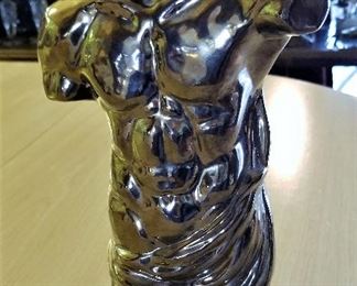 Male torso sculpture.