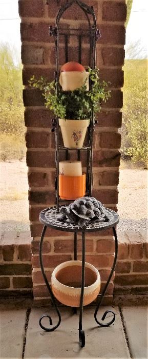 Metal plant stand and flower pots.