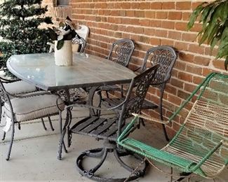 Outdoor glass dining table and chairs. Vintage rocker.