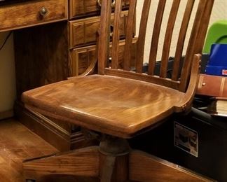 Vintage wooden swivel office chair.