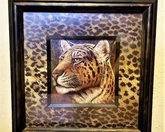 Cheetah art framed in black.
