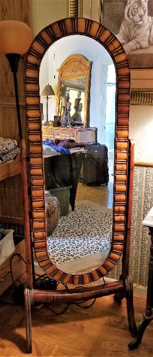 Unusual oval standing floor mirror. 
