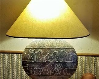 Animal lamp with elephants and giraffes and trees. 