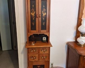 Tall newer cabinet with stenciled doors