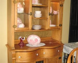 Hutch with pink Currier and Ives dishes