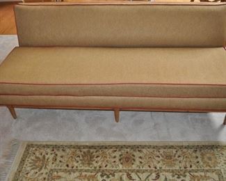 Tomlinson MCM upholstered sofa (72” long x 28.5/16” high x 33” deep) and matching chair (31” wide x 28.5/16” high x 32” deep), both with crisscross wooden back